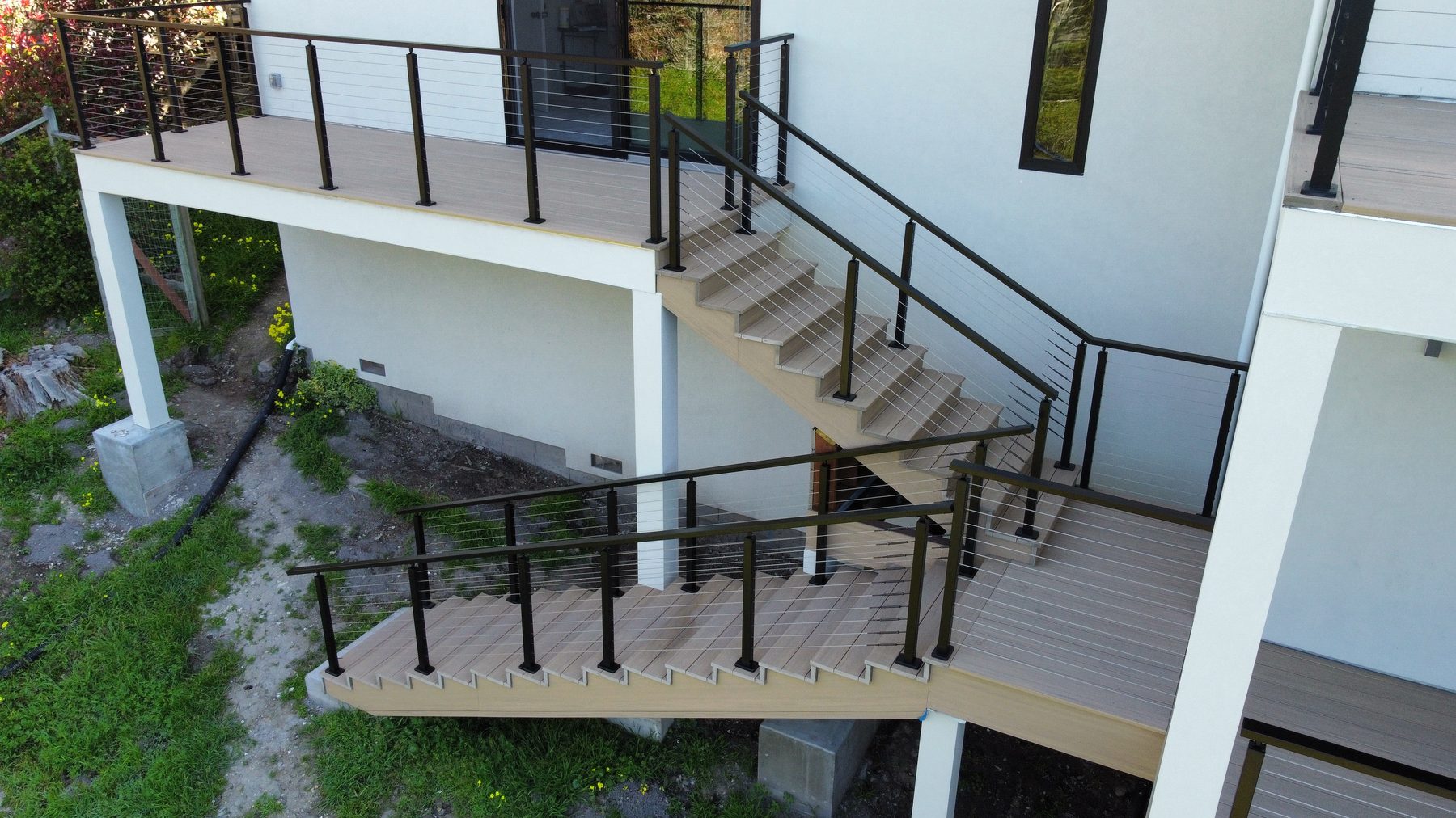 Composite deck with cable railing overlooking a Monterey County hillside